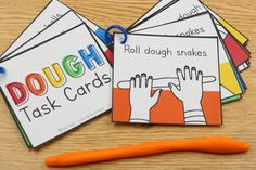 four cards with the words dolchs, roll dough snakes and task cards on them