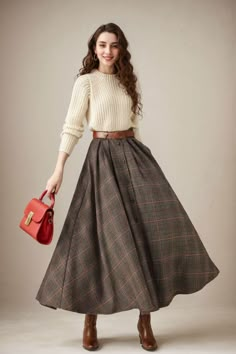 This winter wool skirt is a classic piece of tailoring that will see you through rain or shine. It is cut with a flattering flared skirt to give you a wonderful shape. The winter skirt is perfect classic styling and ends at the ankle. This is a versatile skirt that you'll wear again and again. DETAILS: * 30% wool, 30% fiber, 40% polyester * fully satiny liner * Two side pockets * Buttons closure * has belt loops to keep everything in place  * Plus size full skirt * Ankle length skirt * Perfect for Winter, autumn MODEL SIZE Bust 85 cm(33.4") Waist 67 cm(26.7") Height 168cm (5' 6") She wears size XS Choose CUSTOM Order if you * Need a better fit * Can't find your size in our size Chart * Change the Style * Chang the Length * Your Height is not Between 5'1" - 5"9" * Your weight is over 75 kg Vintage Inspired Outfits Casual, Wool Circle Skirt, Winter Wardrobe Aesthetic, Dark Academia Outfit Long Skirt, Fall Colors Outfits Women, Autumn Long Skirt Outfit, Vintage Skirt Outfit Retro, Long Winter Skirts, 50s Winter Fashion