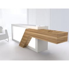 a wooden table sitting next to a white chair