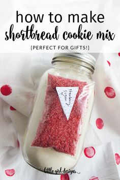 a jar filled with red sprinkles and the words how to make shortbread cookie mix perfect for gifts