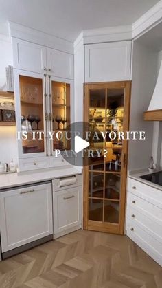 an empty kitchen with white cabinets and wood flooring is featured in the video titled city of favoritee