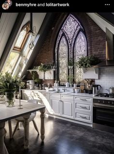 a kitchen with an arched window in the ceiling and white cabinets on the countertop