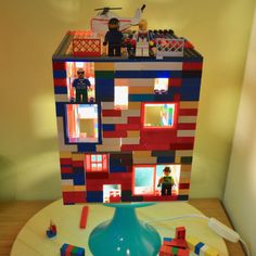 a toy house made out of legos on a table