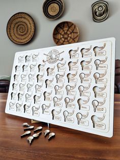 a wooden table topped with lots of magnets