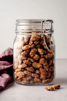 a glass jar filled with food sitting on top of a table