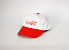 Vintage Coca Cola hat fashion clothes white street fashion festival cap hat strapback one size Red hat hip hop flat brim sun cap unisex gift ------------------------------------------------------------------------------------ New unworn Hat with Coca Cola logo in front. High Fashion - White with Red brim in front and scratch adjuster in the back see all images for details, No dirt marks in Perfect condition see all images for details Brand : MKT promotional products One Size Made in China Condit Hip Hop Cotton Cap, Hip Hop Cotton Hat With Curved Brim, White Visor Snapback Hat For Summer, White Adjustable Dad Hat For Streetwear, White Hats For Summer Sports Events, Hip Hop Style Adjustable Visor Hat, Adjustable Hats For Summer Streetwear, White Hats For Spring Sports Events, Adjustable Hip Hop Visor Hat