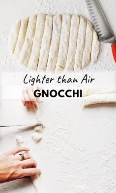 a person cutting up food on top of a white surface with the words lighter than air gnocchi above it