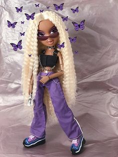 a doll with blonde hair and purple pants standing in front of a white background covered by butterflies