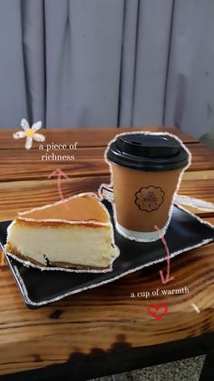 a piece of cheesecake and a cup of coffee on a black plate with white writing