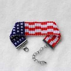 two red, white and blue beaded bracelets on a chain with a lobster hook