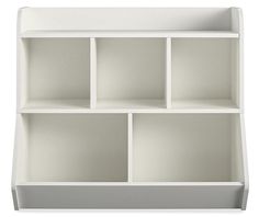 a white shelf with four compartments on each side