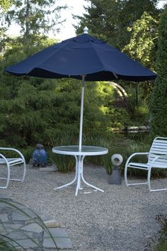 bright outdoor seating on gravel surrounded by green trees with a Koi Pond in the background Queen Room, The Pond, The Fish