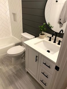 a bathroom with a sink, toilet and bathtub