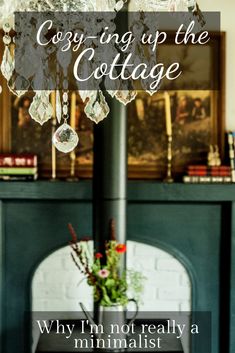 a fireplace with the words cozy up the cottage on it and an image of a chandelier