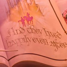 an open book with pink flowers on the cover and words written in gold lettering that says, and so many things happily ever after