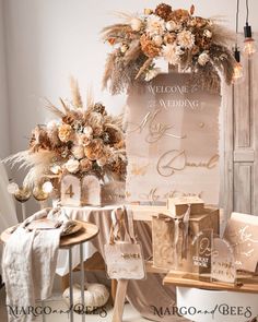 the wedding sign is surrounded by flowers and bags for guests to take home from their ceremony