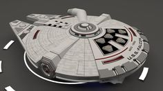 a model of a star trek ship on a gray surface with arrows pointing in different directions