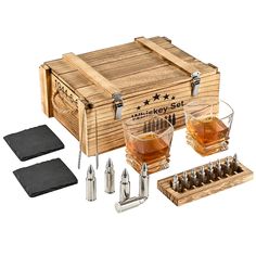 a wooden box filled with lots of different types of liquors and shots in front of it