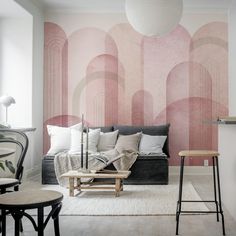 a living room with pink and grey wallpaper