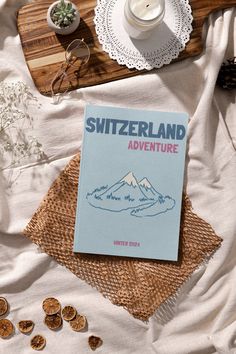 Turn your favorite SWITZERLAND vacation photos into a travel photo book! Get your photos off your phone or camera to create your own Assouline-inspired travel coffee table book- perfect for having a keepsake of your memories! Our template features the front and back cover pages that are easily editable with a FREE version of Canva. Edit all the fonts, colors and resize any objects (or add new text and images of your own!) WHAT YOU GET: - Front cover - Center page with SWITZERLAND map w/ ZURICH h Travel Coffee Table Books, Flatlay Book, Travel Photo Book, Switzerland Map, Photo Book Template, Switzerland Vacation, Assouline Books, Coffee Book, Canva Edit