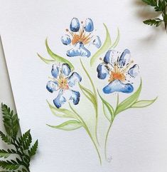 watercolor painting of blue flowers on white paper next to green leaves and plant life