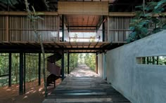 the inside of a building with wooden floors and stairs leading up to an upper level