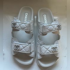 Bnwt Chanel 24p G45507b15805 White Backless Cc Logo Slide Dad Sandals, Size 38.5. Serial Number In Last Two Images. Brand New. 100% Authentic. Includes Box, Dust Bags, Cards. The Most In Demand Shoe On The Market From Chanel Spring Collection. Beautiful White Quilted Lambskin Leather With Cc Logo’s Made In Italy. All Sales Are Final. Item Will Be Shipped Insured Requiring Adult Signature. Chanel Slides Sandals, White Chanel Sandals, Chanel White Sandals, Luxury Platform Slip-on Sandals, Luxury Leather Platform Slides, Luxury Slides With Removable Insole, Luxury White Open Heel Sandals, Luxury Slides With Platform And Round Toe, Luxury Slip-on Platform Sandals