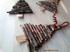 a group of sticks are arranged in the shape of a christmas tree on a table