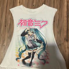 a white tank top with an anime character on it