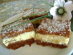 there is a piece of cake with powdered sugar on it and a flower in the middle