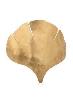 a gold leaf shaped object on a white background