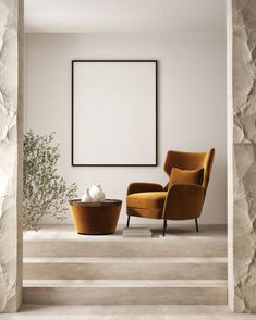 a living room with two chairs and a coffee table in front of a white wall