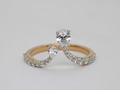 an image of two wedding rings with diamonds