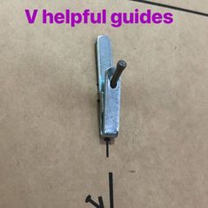 a metal object with the words v helpful guides next to it on a cardboard background