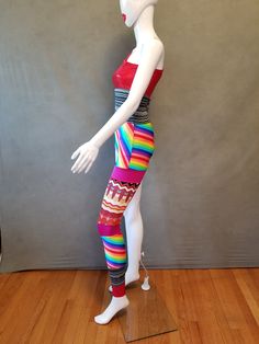 "Inspired by a bodysuit that David Bowie wore back in the 70's comes this limited edition bodysuit to celebrate Pride. Perfect for any David Bowie fan! It is made with 5 different kinds of knit fabrics that are stretch spandex and cotton/poly. The red knit fabric has is a shiny holographic spandex print READY TO SHIP S- 34-35\" Bust, 26-27\" Waist, 35-37\" Hips Sleeve Length from shoulder to hem- 21\" Pant Length from waist to hem- 38\" Girth - 58\" Please feel free to contact me with any questi Stretch Multicolor Unitard, Festival Fitted One-piece Bodysuit, Fitted One-piece Bodysuit For Festival, Fitted Multicolor Bodysuit, Retro Fitted Multicolor Bodysuit, Retro Fitted Sleeveless Bodysuit, Bowie Ziggy Stardust, David Bowie Ziggy, Bodysuit Costume