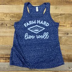 a women's blue tank top that says farm hard, live well on it