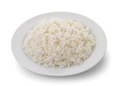 white rice in a plate on a white background