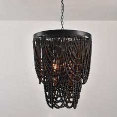 a chandelier with beads hanging from the ceiling