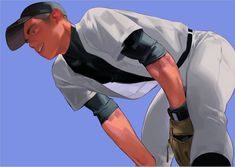 a baseball player bending down to pick up the ball