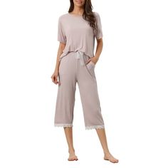 Great for loungewear, nightwear, sleepwear, home bedroom, daily wear. Featuring:2 pieces, short sleeve top, elastic waist capri. Comfortable and skin friendly fabric, which makes you feel more comfy and relaxed when wearing this sleepwear. Design: Round neck, short sleeve tops cami and trousers,pant leg part uses lace elements. These modal pajama sets is the lace trim that adorns the edges of the cami and capri.The sleepwear is casual but comfy. Modal pajama sets are a must-have for women who va Summer Pajama Set, Lace Trim Shorts, Plus Size Pajamas, Summer Pajamas, Womens Pyjama Sets, Short Pajama Set, Printed Tank Tops, Pajamas Women, Daily Wear