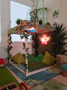 a room filled with lots of plants and stuffed animals on top of it's beds