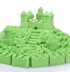 a green sand castle with stairs and steps in the middle, on a white background