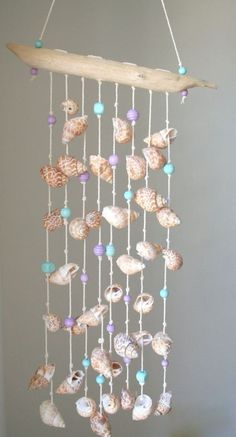 a wind chime with seashells hanging from it