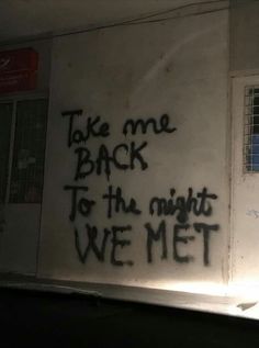 graffiti on the side of a building reads take me back to the night we met