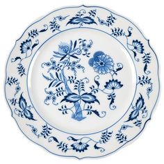 a blue and white plate with flowers on it