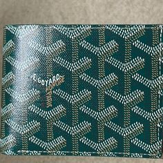 Brand New W/Tags - Bfold Men's/Unisex Wallet - In Beautiful And Most Coveted Green. Harder And Harder To Get These Days. Goyard Is Limiting Their Colors And Sales Of Items. Goyard Just Did Their Price Increase For 2024 So Prices Have Gone Up Again! Beautiful Goyard Card Holder In Brilliant House Color Green. A Traditional Color And A Timeless Classic Piece. Goyardine Canvas And Calfskin Leather. This Is A Rare Beautiful Color! In Perfect/Mint Condition. Unworn, Unused. Negotiable. Offers Accepte Designer Green Wallets With Interior Card Slots, Designer Green Wallet With Interior Card Slots, Green Designer Wallets With Interior Card Slots, Luxury Gold Bifold Wallet, Designer Green Wallet As Gift, Designer Green Wallets As Gift, Designer Green Wallets For Gift, Luxury Green Bifold Wallet, Designer Green Wallet For Daily Use