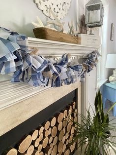 a fireplace with blue and white ribbons hanging from it