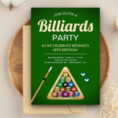 a birthday party card with billiards and pool balls on it, next to a wooden plate