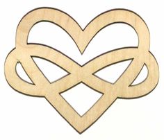 an unfinished wooden ornament with two intertwined hearts