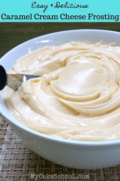 a white bowl filled with caramel cream cheese frosting